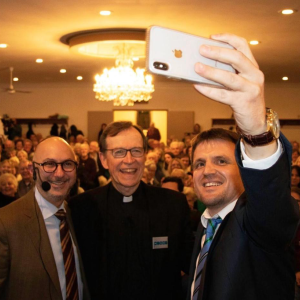 A rabbi, priest and imam taking a selfie