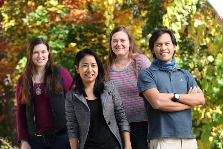 Four students standing outside