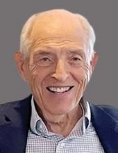 Headshot of older man with white hair