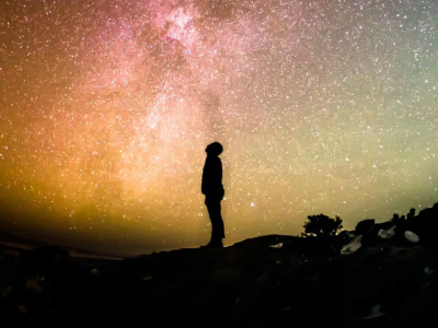 Person looking up at night sky