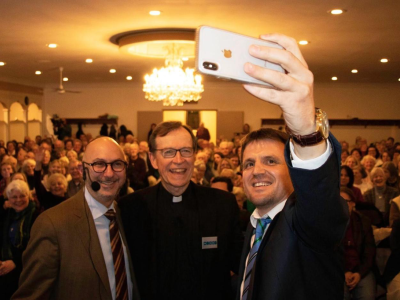 A rabbi, priest and imam taking a selfie